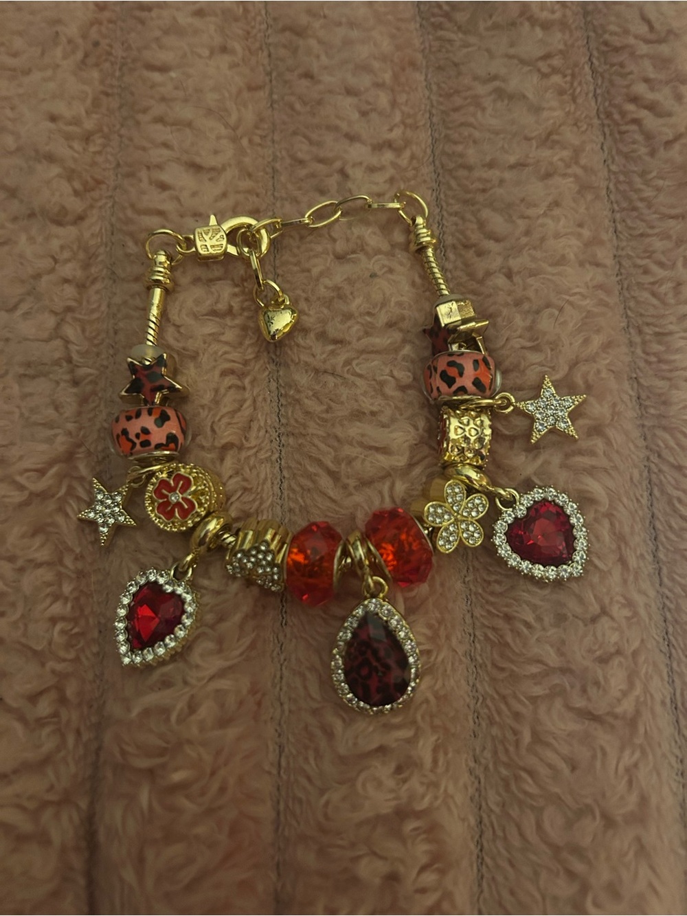 Gold-Tone Red Crystal Charm Bracelet with Heart, Star and Floral Charms